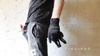Watch this guy with a big uncut cock get off on draining cum while smoking in public