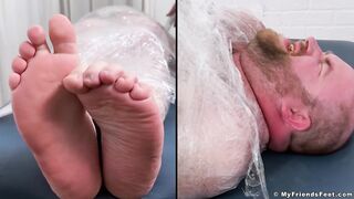 Tommy Bearhama's toes get tickled and tortured while he's mummified