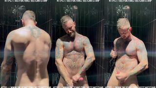 Watch as tattooed muscle stud Troy Daniels wanks off in a steamy shower