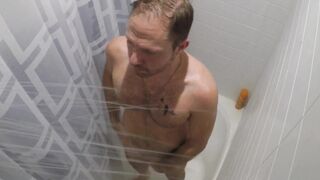 Homemade teen shows off tattoos & gives a hot handjob in the bathroom